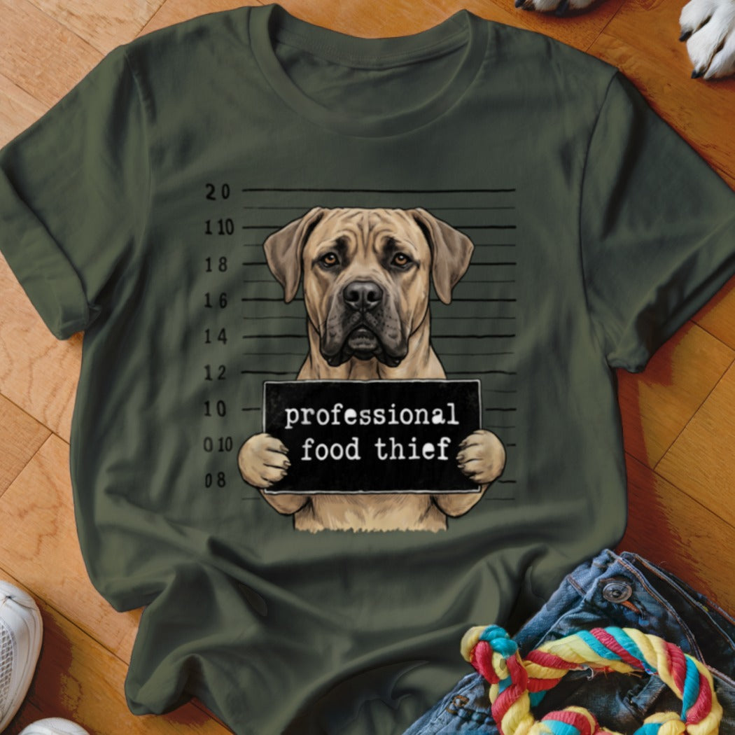 Dog mugshot with text "professional food thief" on a green shirt.