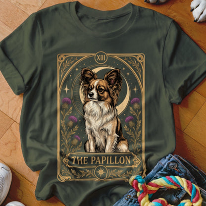 Dark green t-shirt featuring a tarot card graphic of a Papillon dog with thistle flowers.