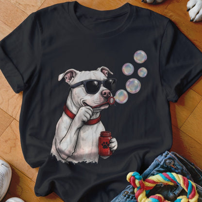 A black short-sleeved t-shirt features an illustration of a white dog wearing sunglasses and blowing bubbles.