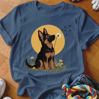 Dark blue crewneck t-shirt featuring a cartoon German Shepherd puppy sniffing a dandelion against a yellow sun.