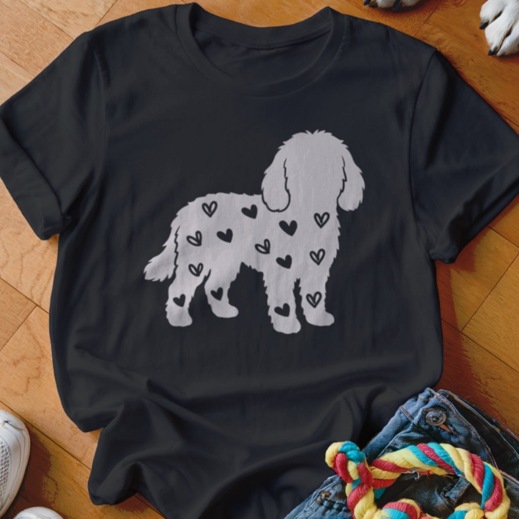 Black t-shirt with a white silhouette of a dog covered in black hearts.