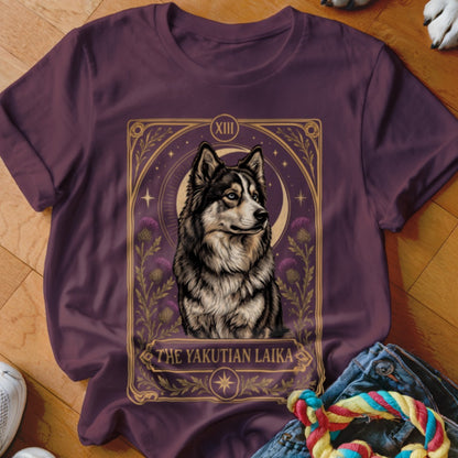 Plum t-shirt featuring a tarot card style graphic of a Yakutian Laika dog with text.