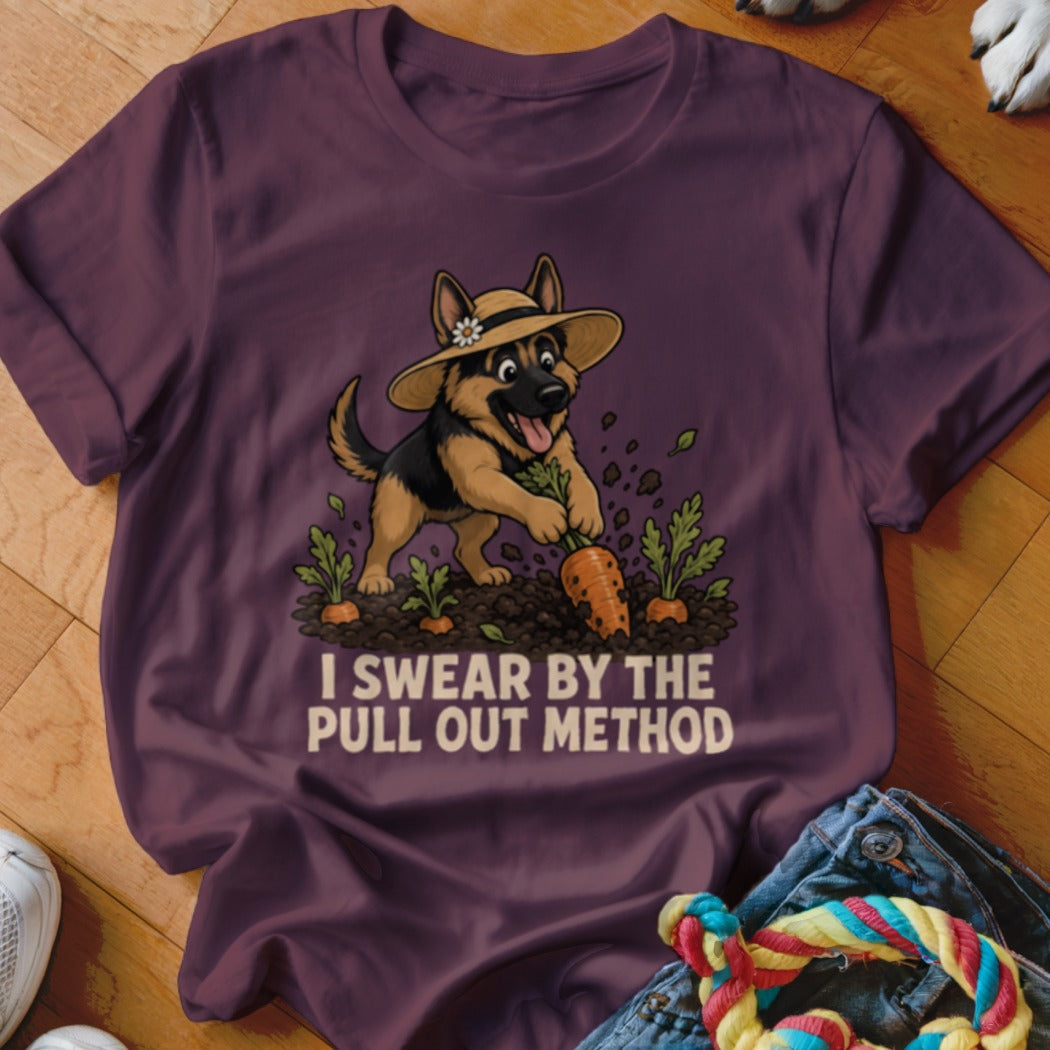German Shepherd in a straw hat gardening, pulling carrots, text: I SWEAR BY THE PULL OUT METHOD.