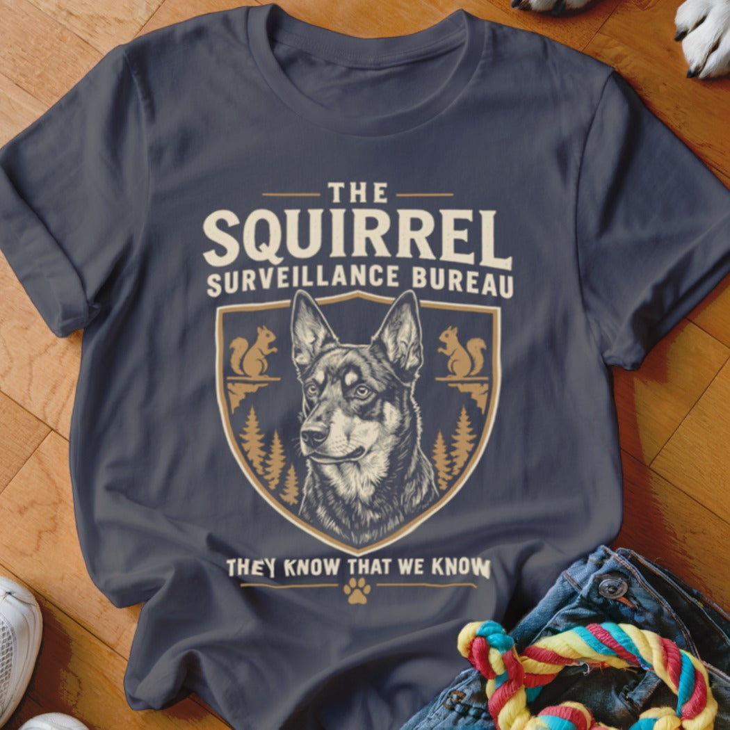 Dark grey t-shirt featuring a dog graphic inside a crest and the text The Squirrel Surveillance Bureau.