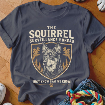 Dark grey t-shirt featuring a dog graphic inside a crest and the text The Squirrel Surveillance Bureau.