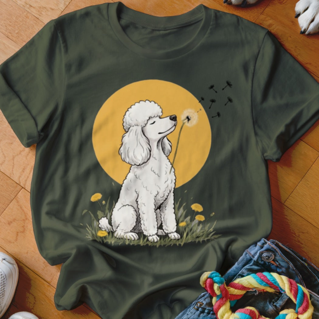 Dark green t-shirt featuring an illustration of a white poodle sniffing a dandelion against a yellow circle.