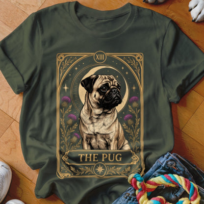 Dark green t-shirt featuring a tarot card graphic with a pug, crescent moon, and purple thistles.