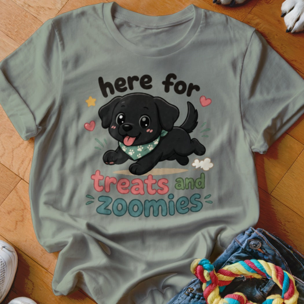 Black puppy graphic with text "here for treats and zoomies" on a grey t-shirt.
