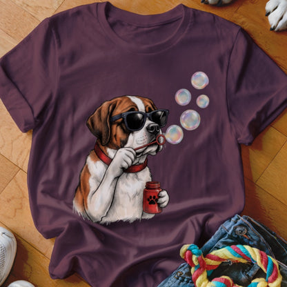 A purple t-shirt featuring a graphic of a Saint Bernard wearing sunglasses and blowing bubbles.