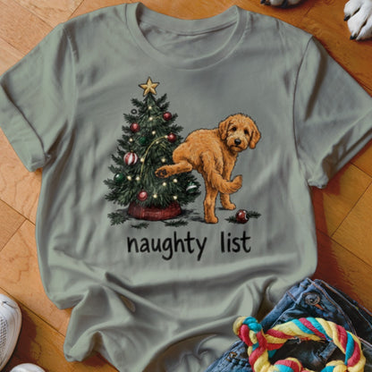 Goldendoodle next to a Christmas tree with "naughty list" text.