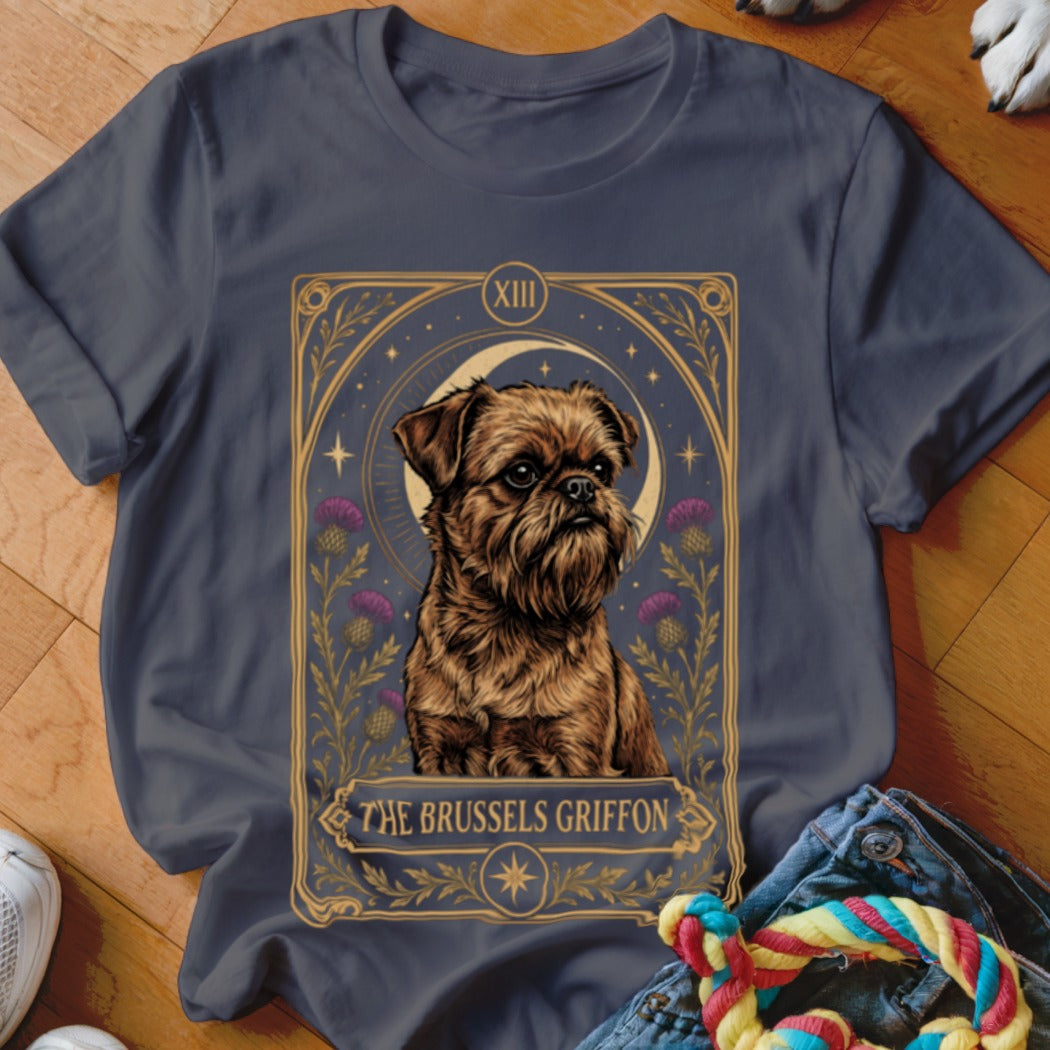 A charcoal gray t-shirt featuring a tarot card graphic of a Brussels Griffon surrounded by flowers and a crescent moon.