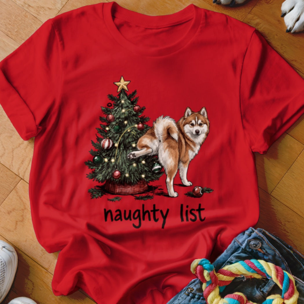 Red t-shirt with a Christmas tree and a dog's leg on top, text "naughty list".