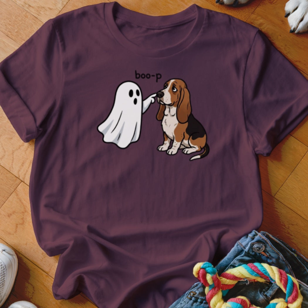Ghost "boop-ing" a Basset Hound on a maroon t-shirt.