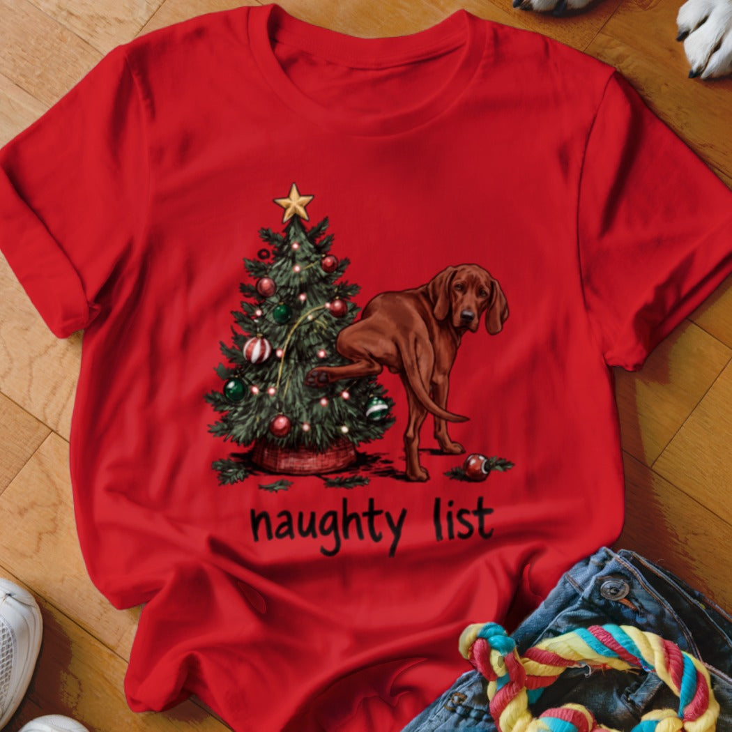 Red t-shirt with a Christmas tree and a brown dog, text reads "naughty list".