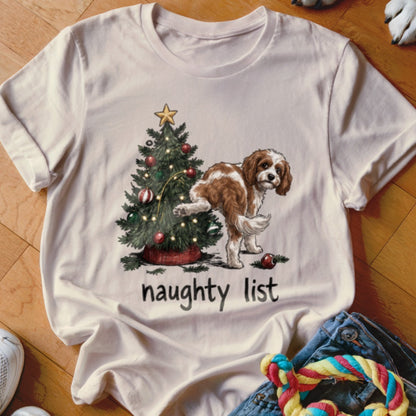 Cream t-shirt with Christmas tree and dog humorically labeled "naughty list."
