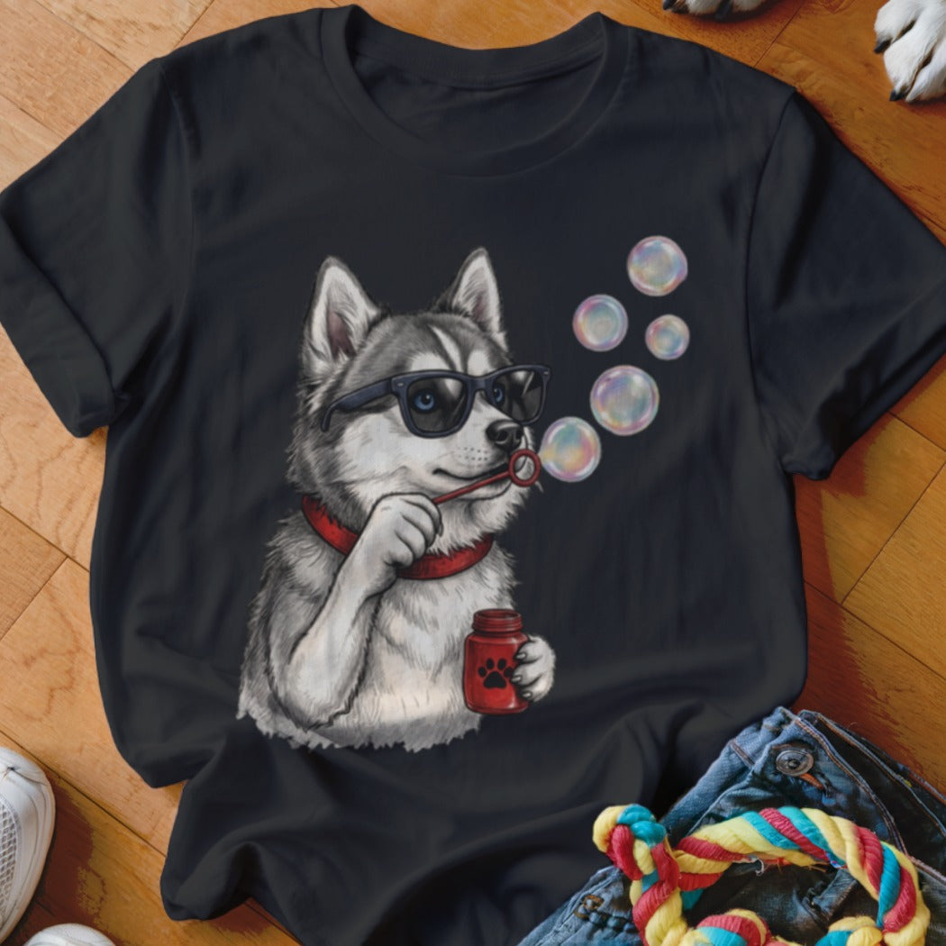 A black t-shirt features a graphic of a husky wearing sunglasses and blowing bubbles.