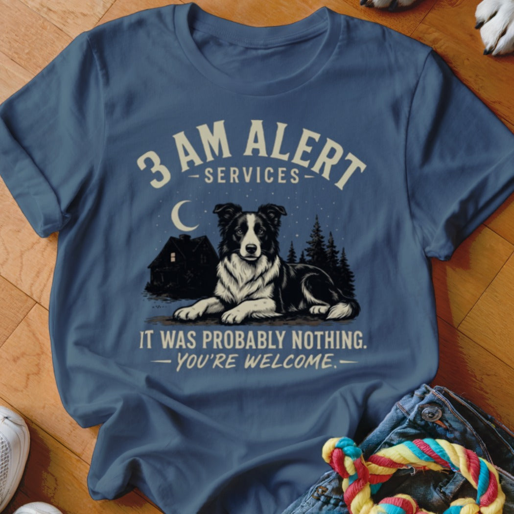 Blue t-shirt with graphic of border collie, house, moon, and text.