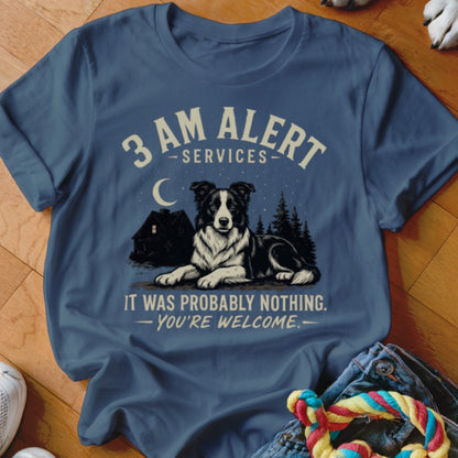Blue t-shirt with graphic of border collie, house, moon, and text.