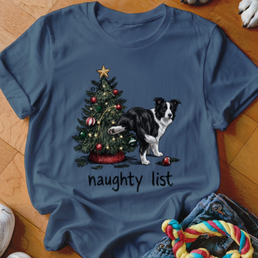 A Border Collie lifts its leg on a Christmas tree with text "naughty list".