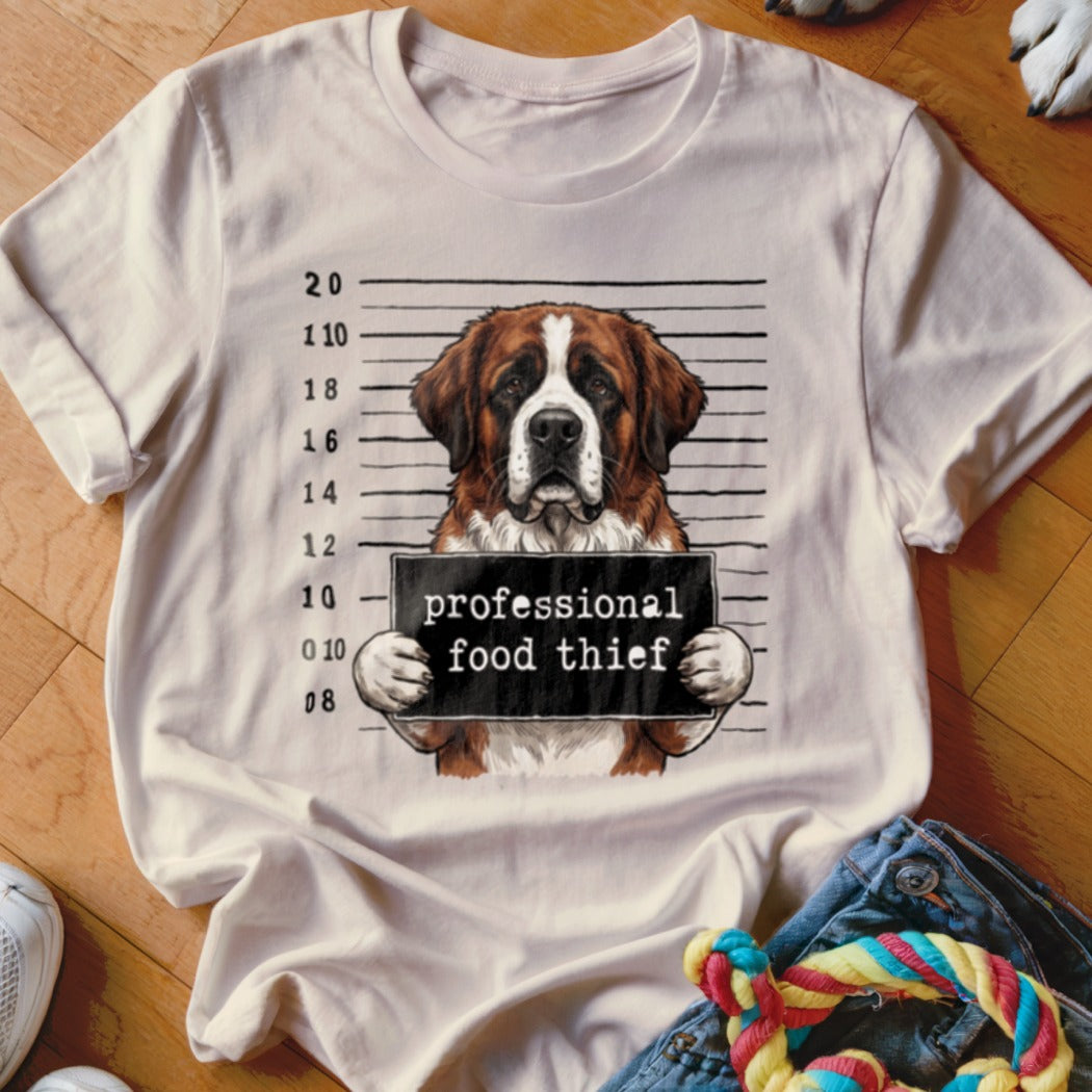 Saint Bernard dog mugshot with "professional food thief" sign.