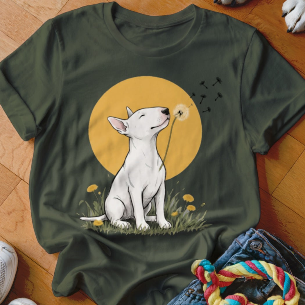 Dark green t-shirt featuring an illustration of a white bull terrier blowing a dandelion in a grassy field.