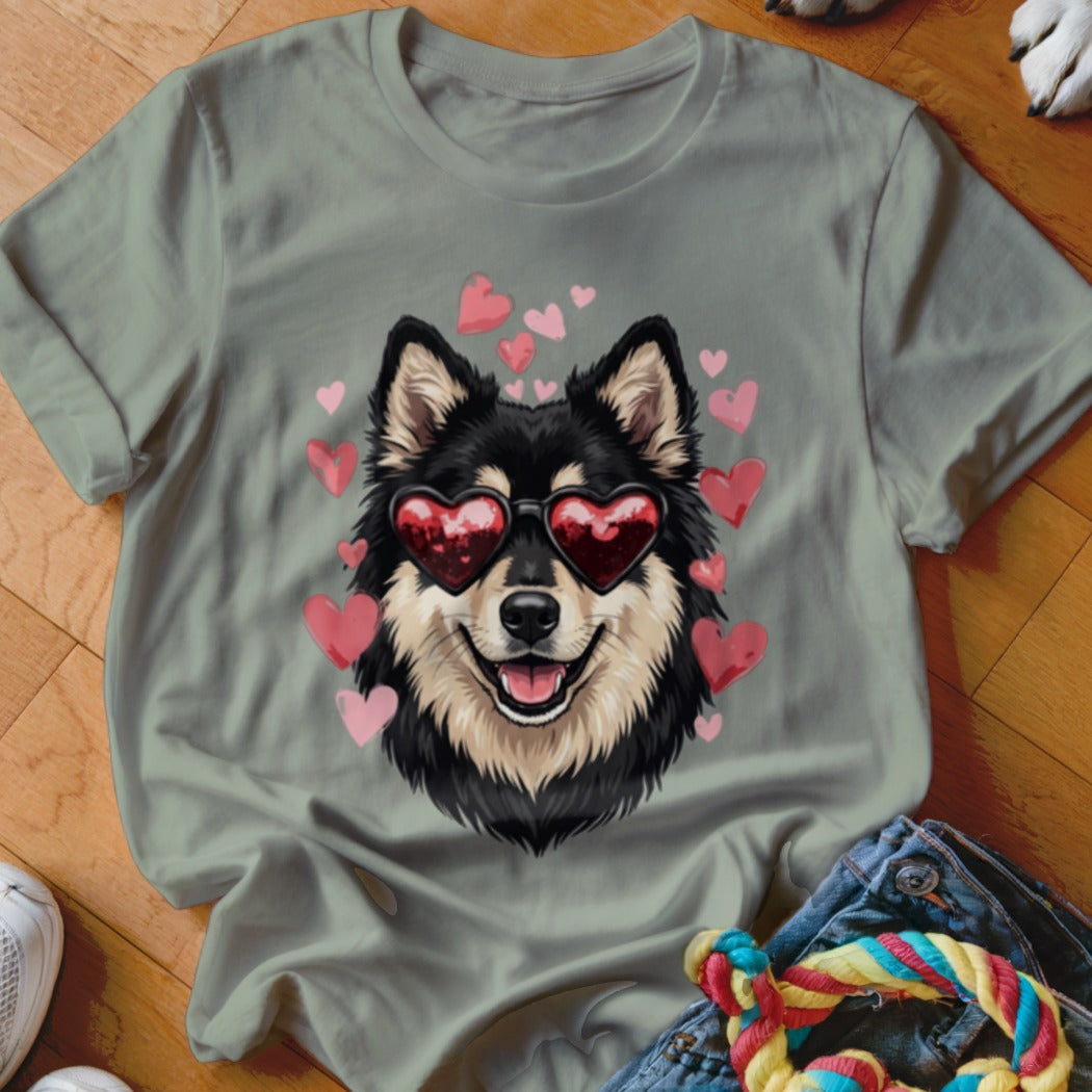 Sage green t-shirt featuring a graphic of a black and tan dog wearing heart-shaped sunglasses surrounded by pink hearts.