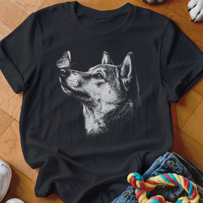A black crewneck t-shirt featuring a white line drawing of a husky looking up at a butterfly on its nose.