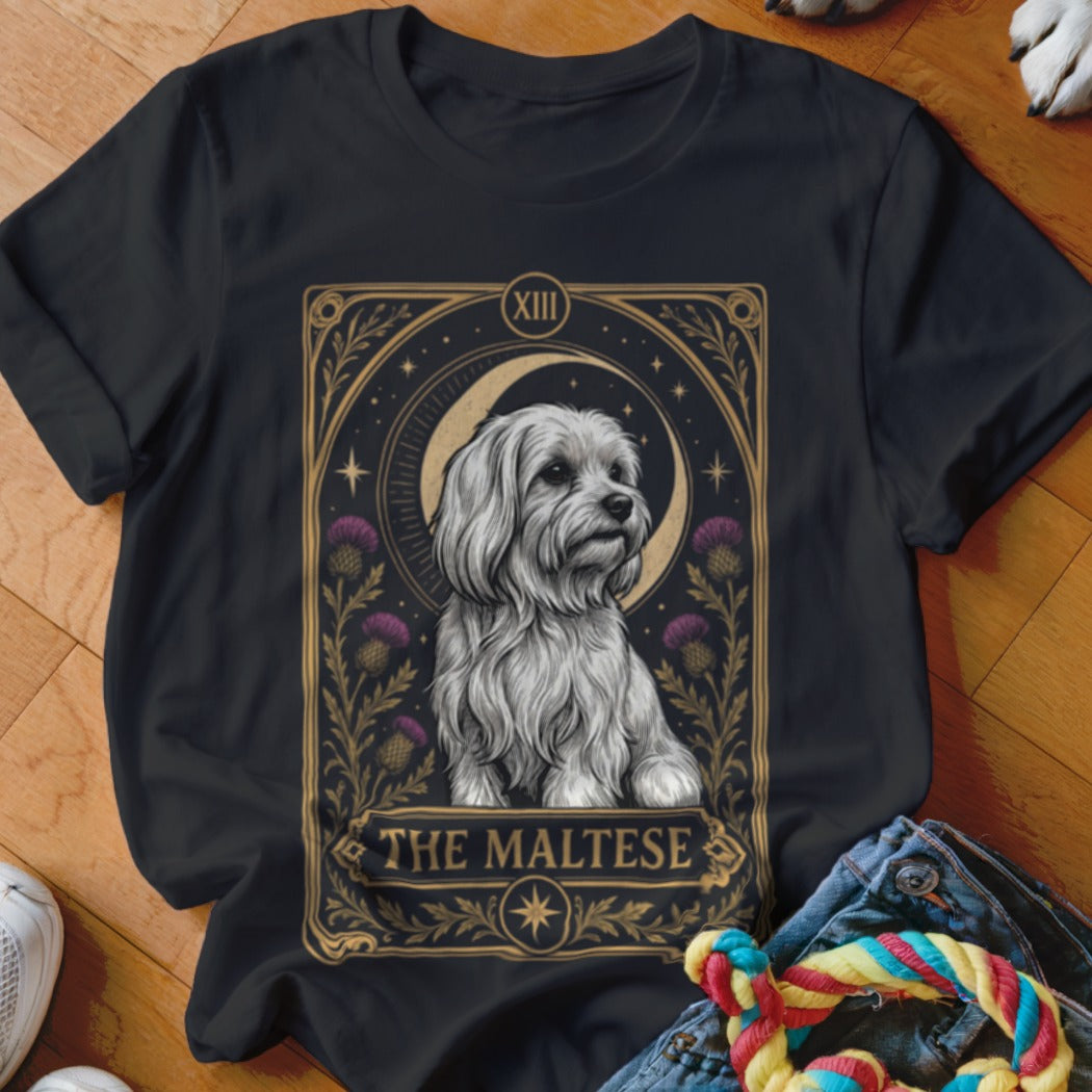 Black t-shirt featuring a tarot-style graphic of a Maltese dog flanked by purple thistles.