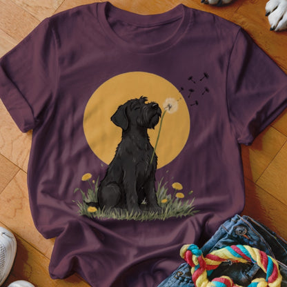 A dark purple t-shirt featuring a graphic of a black dog blowing a dandelion.