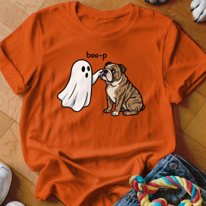 Cartoon ghost booping a bulldog with text "boo-p" on orange shirt.