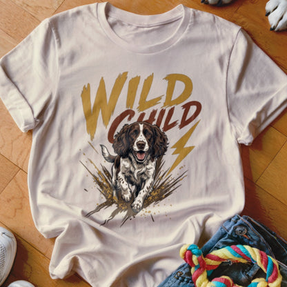 A cream-colored t-shirt with a graphic of a running spaniel and the text WILD CHILD.