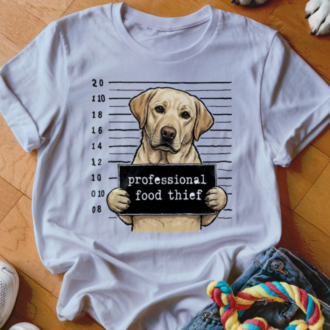 Labrador retriever mugshot on white t-shirt reads "professional food thief".