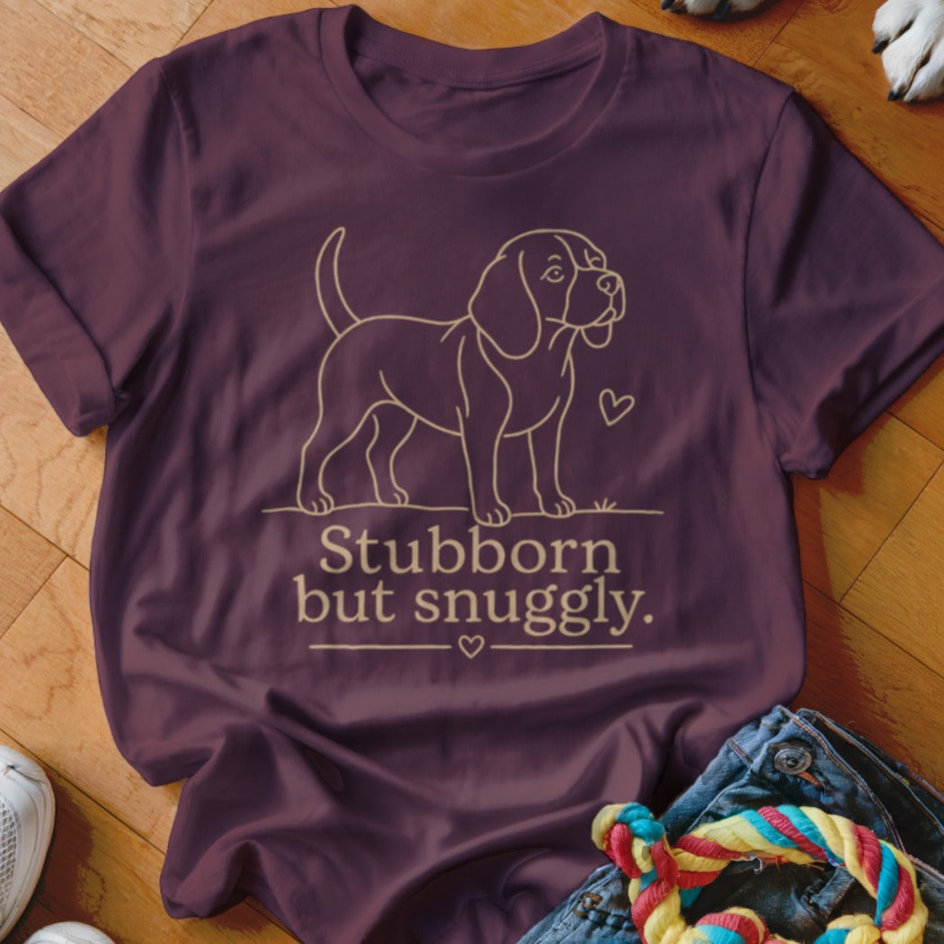 Burgundy t-shirt with outline of a beagle and text "Stubborn but snuggily."