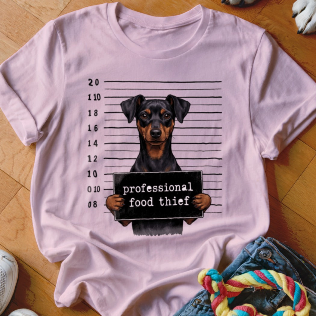 Pink t-shirt featuring a Miniature Pinscher mugshot with text "professional food thief".
