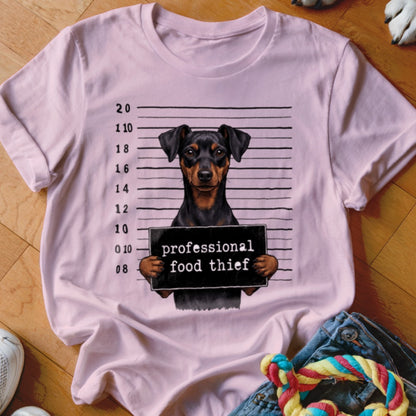 Pink t-shirt featuring a Miniature Pinscher mugshot with text "professional food thief".