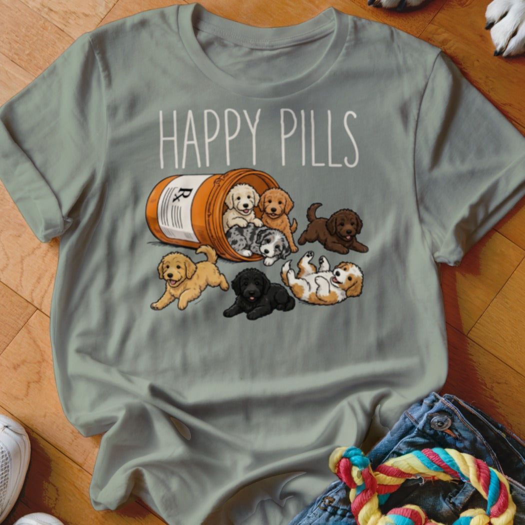 T-shirt with "Happy Pills" text and puppies spilling from a prescription bottle.