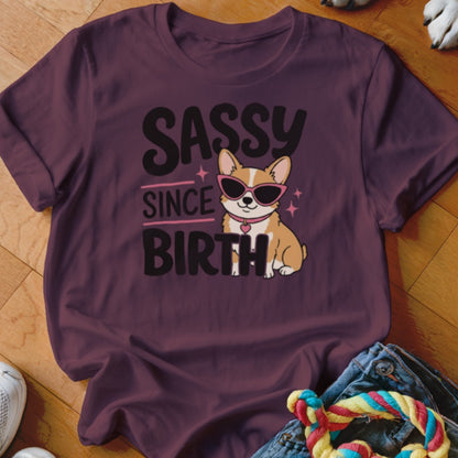 Burgundy t-shirt with "Sassy Since Birth" text and a corgi wearing sunglasses.