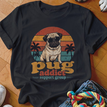 Black t-shirt featuring a pug in sunglasses against a sunset graphic and the text Pug Addict Support Group.