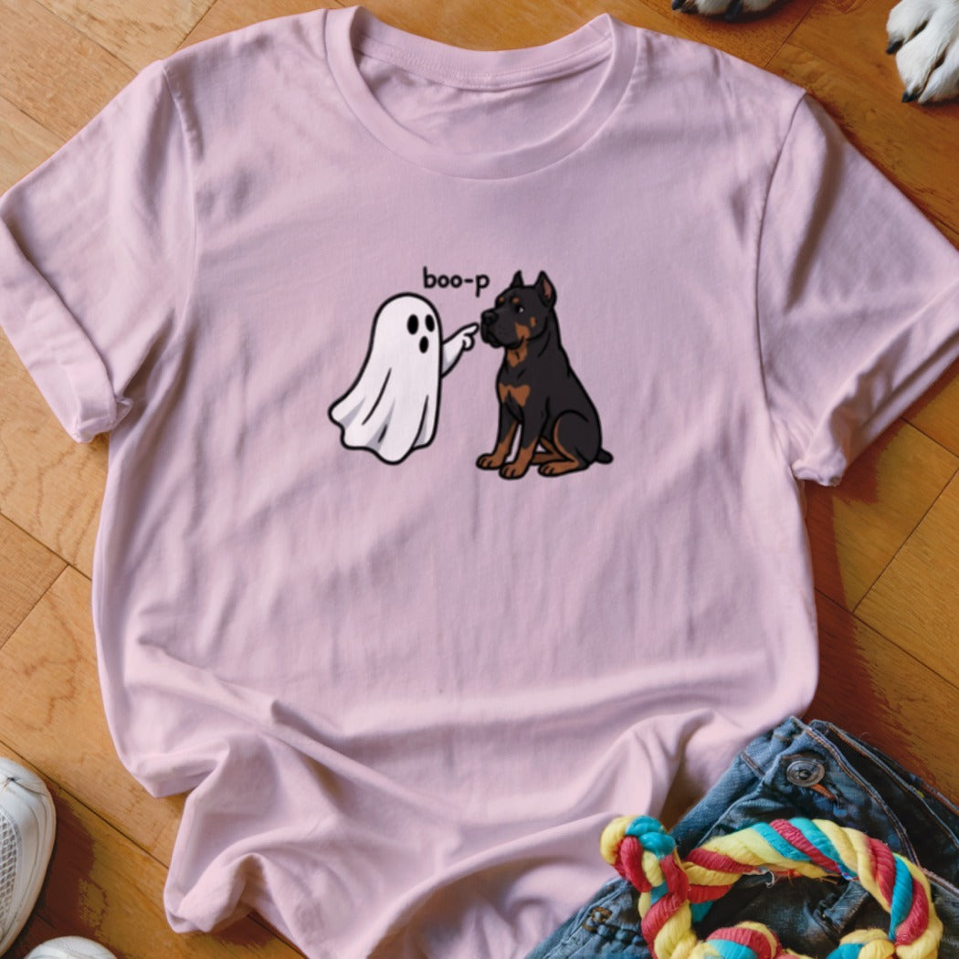 Pink t-shirt with a ghost saying "boo-p" to a seated Rottweiler dog.