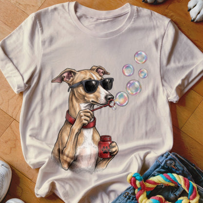 Beige t-shirt featuring a graphic of a dog wearing sunglasses and blowing soap bubbles.