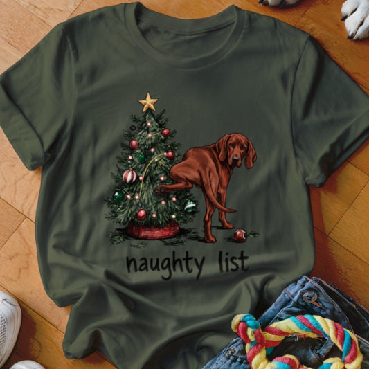 Dog lifting leg on Christmas tree with text "naughty list" below.