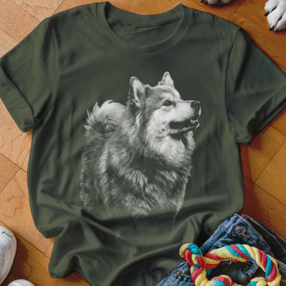 Green t-shirt with a black and white print of a fluffy dog.