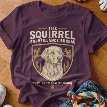 Maroon crewneck t-shirt featuring a golden retriever illustration within a crest, accompanied by text.