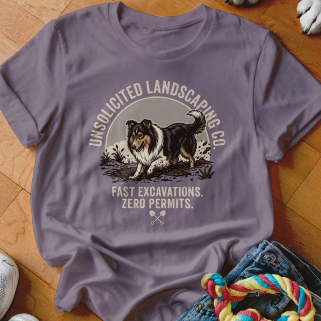 T-shirt with a Collie dog digging and text "Unsolicited Landscaping Co. Fast Excavations. Zero Permits."