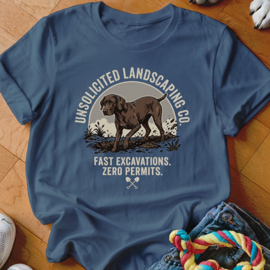 Blue t-shirt with graphic of a dog, "UNSOLICITED LANDSCAPING CO." and "FAST EXCAVATIONS. ZERO PERMITS."