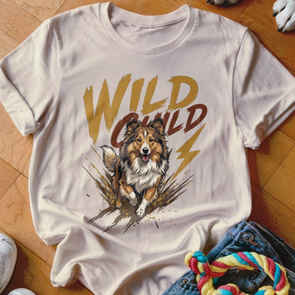 A cream-colored t-shirt with a graphic of a running dog and the text Wild Child.