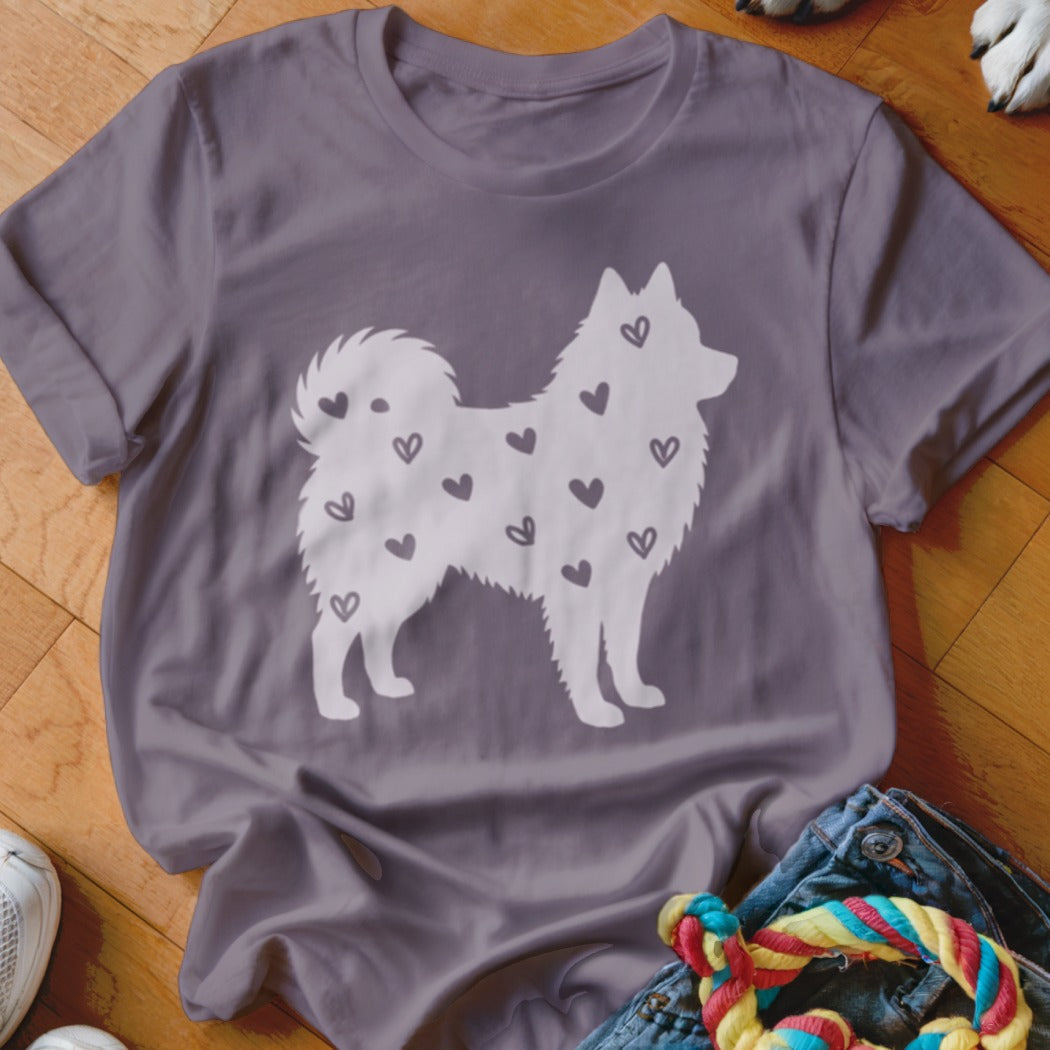 T-shirt with white silhouette of a dog covered in small hearts.