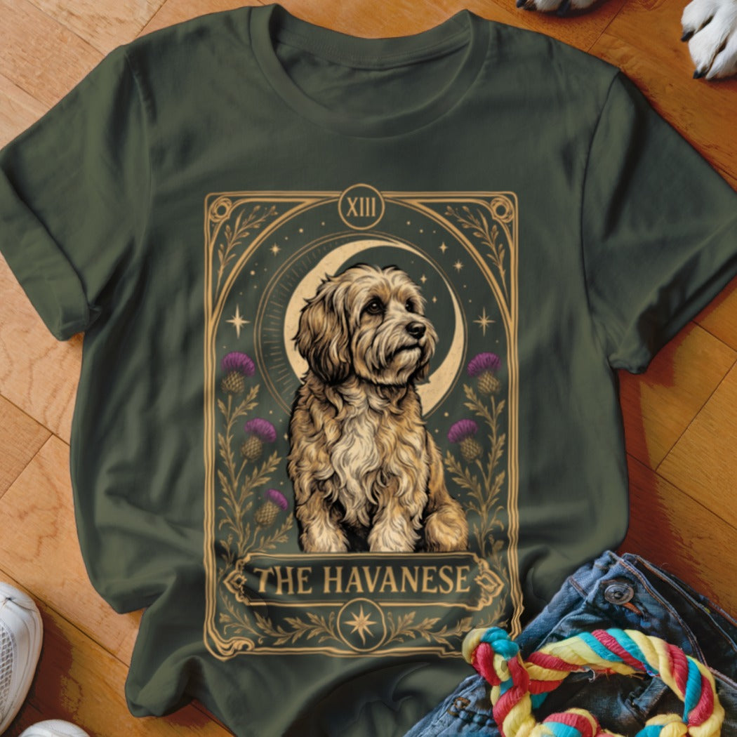 Dark green t-shirt featuring a tarot card graphic with a Havanese dog, crescent moon, thistles, and text.
