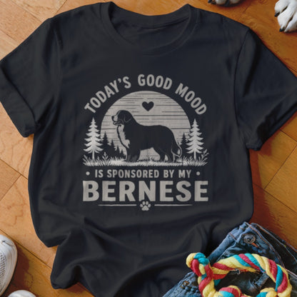A black t-shirt printed with a Bernese Mountain Dog graphic and the text TODAYS GOOD MOOD IS SPONSORED BY MY BERNESE.