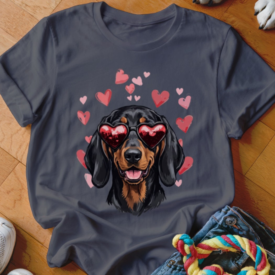 Charcoal crewneck t-shirt featuring a graphic of a dachshund wearing heart-shaped sunglasses surrounded by floating pink hearts.